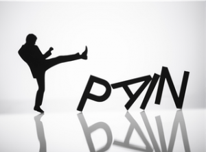 Man Kicking Down the Letters P A I N